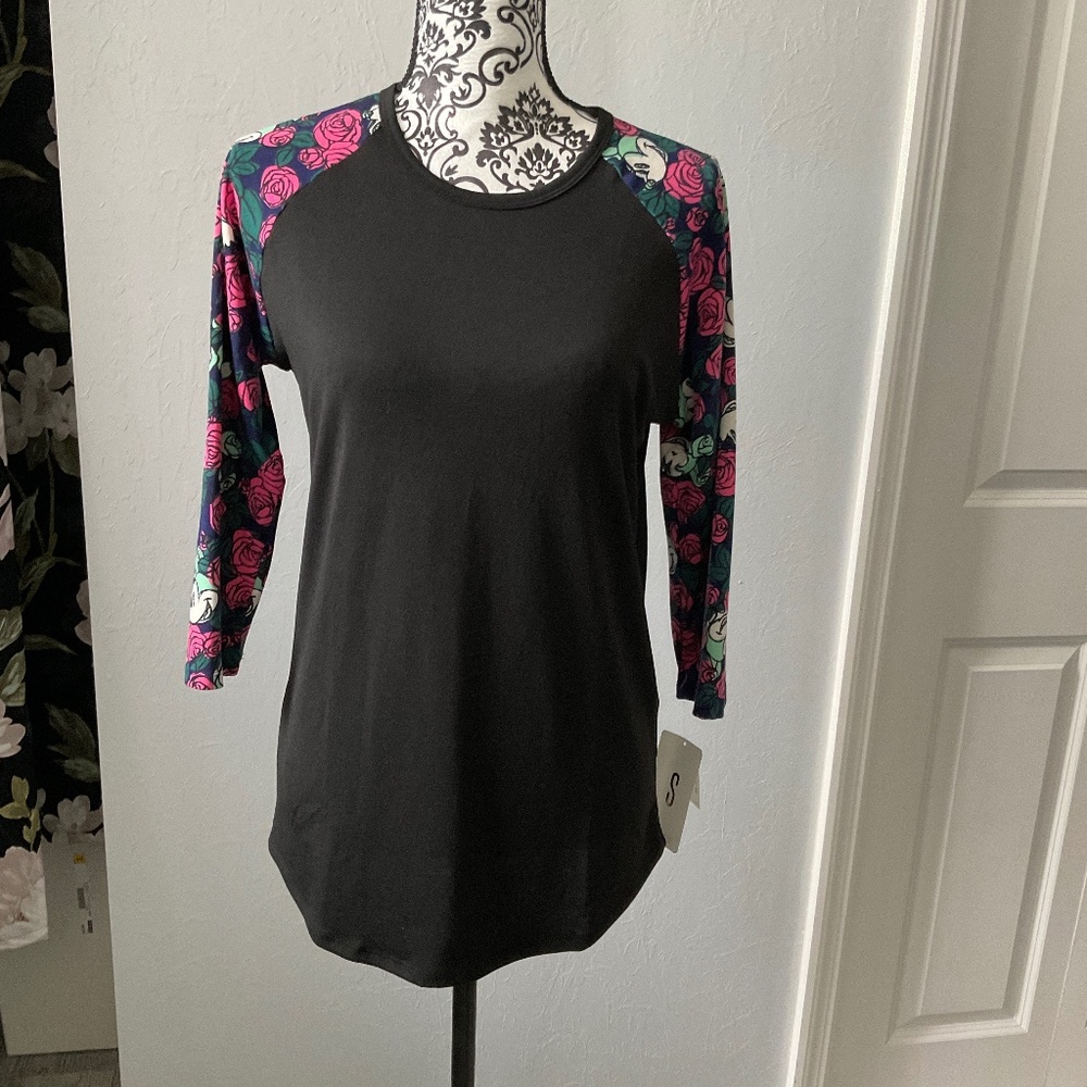 Black quarter cut sleeve with hidden Mickey in flowers on the sleeves.